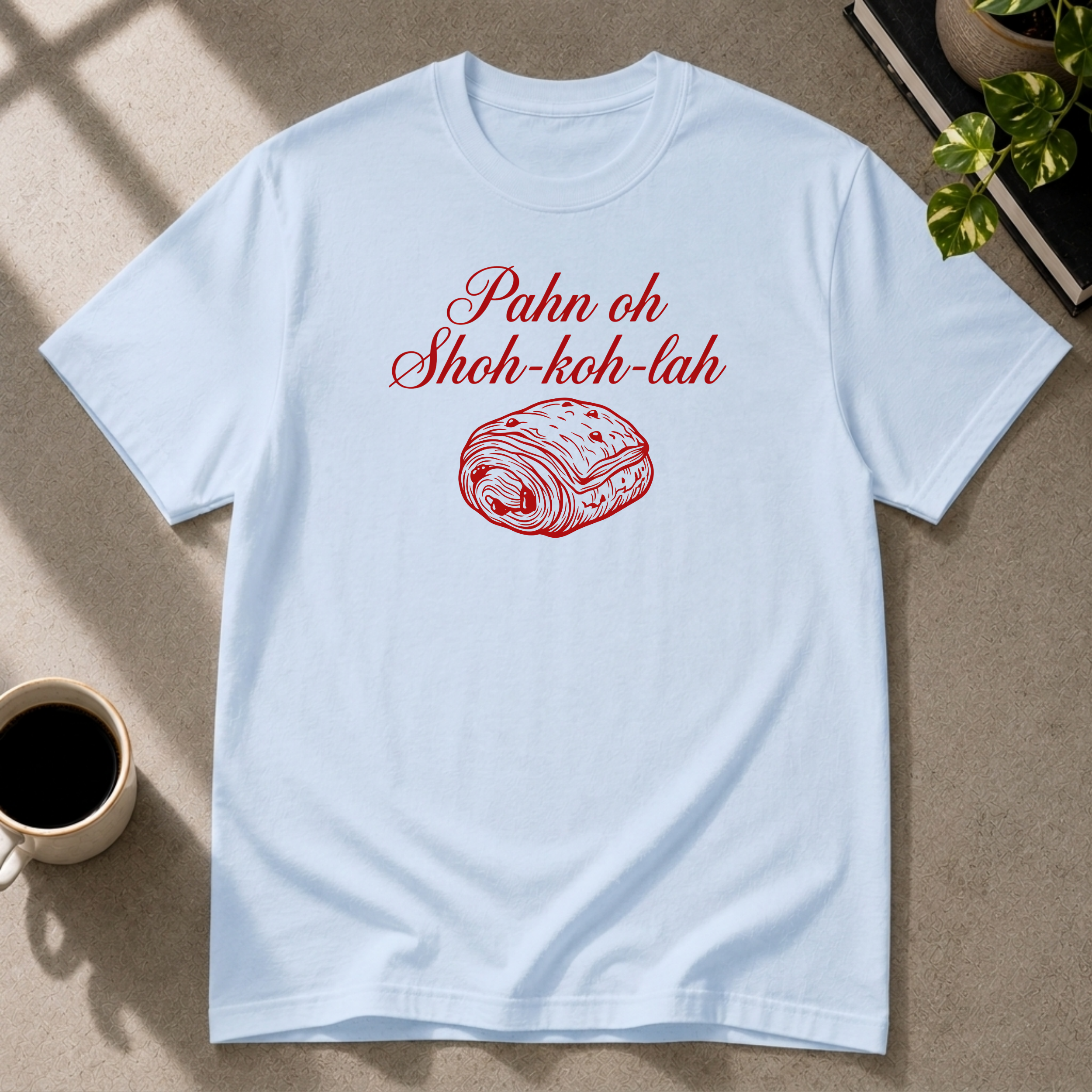 Chocolate Croissant graphic T-shirt on light blue tee by Butter & Tonic